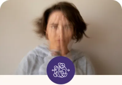 A woman resting her hand on her forehead, representing anxiety