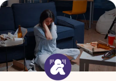 A woman sitting alone on a sofa, representing depression